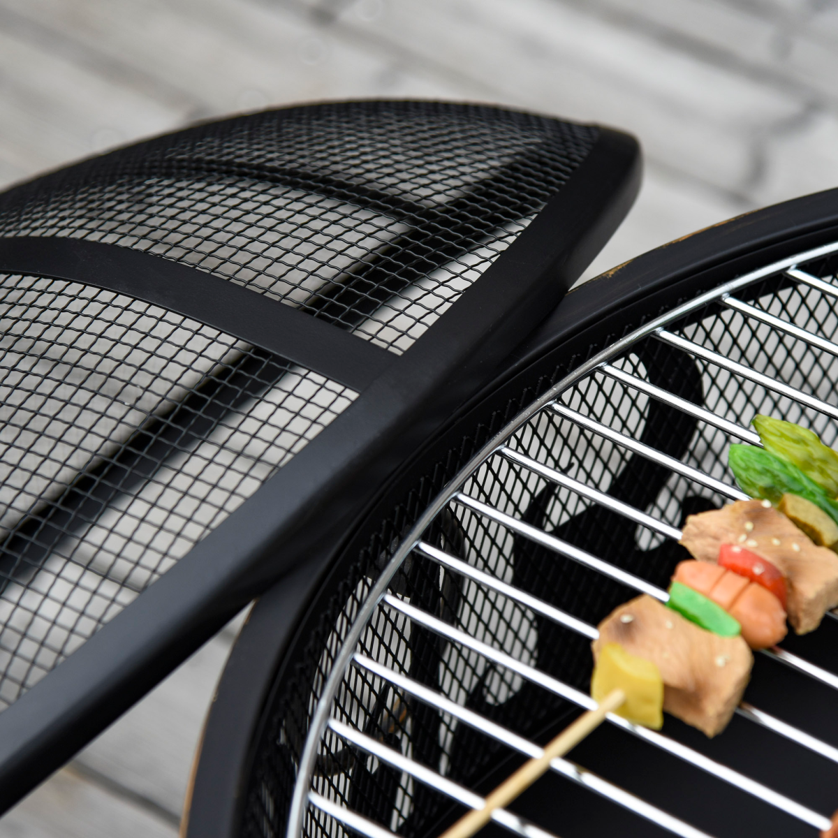 Outsunny 61.5cm 2-in-1 outdoor fire pit and BBQ garden cooker with firewood storage and heater function.