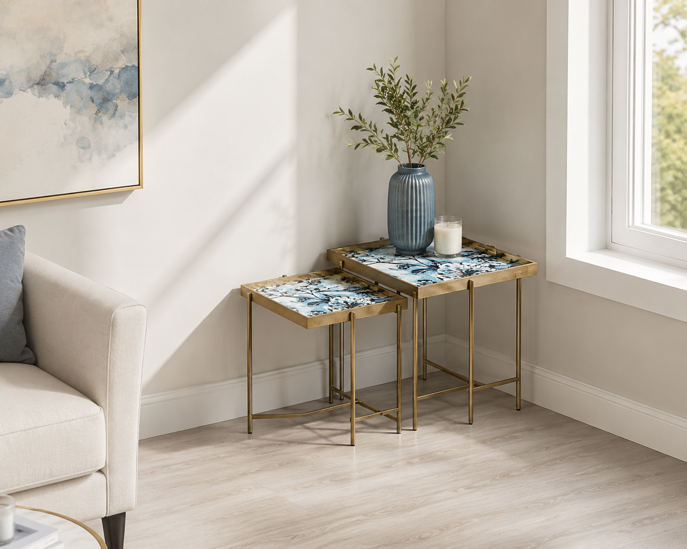 Set of 2 MSL Art Deco nesting side tables with gold floral marble effect square surfaces and sleek modern design.