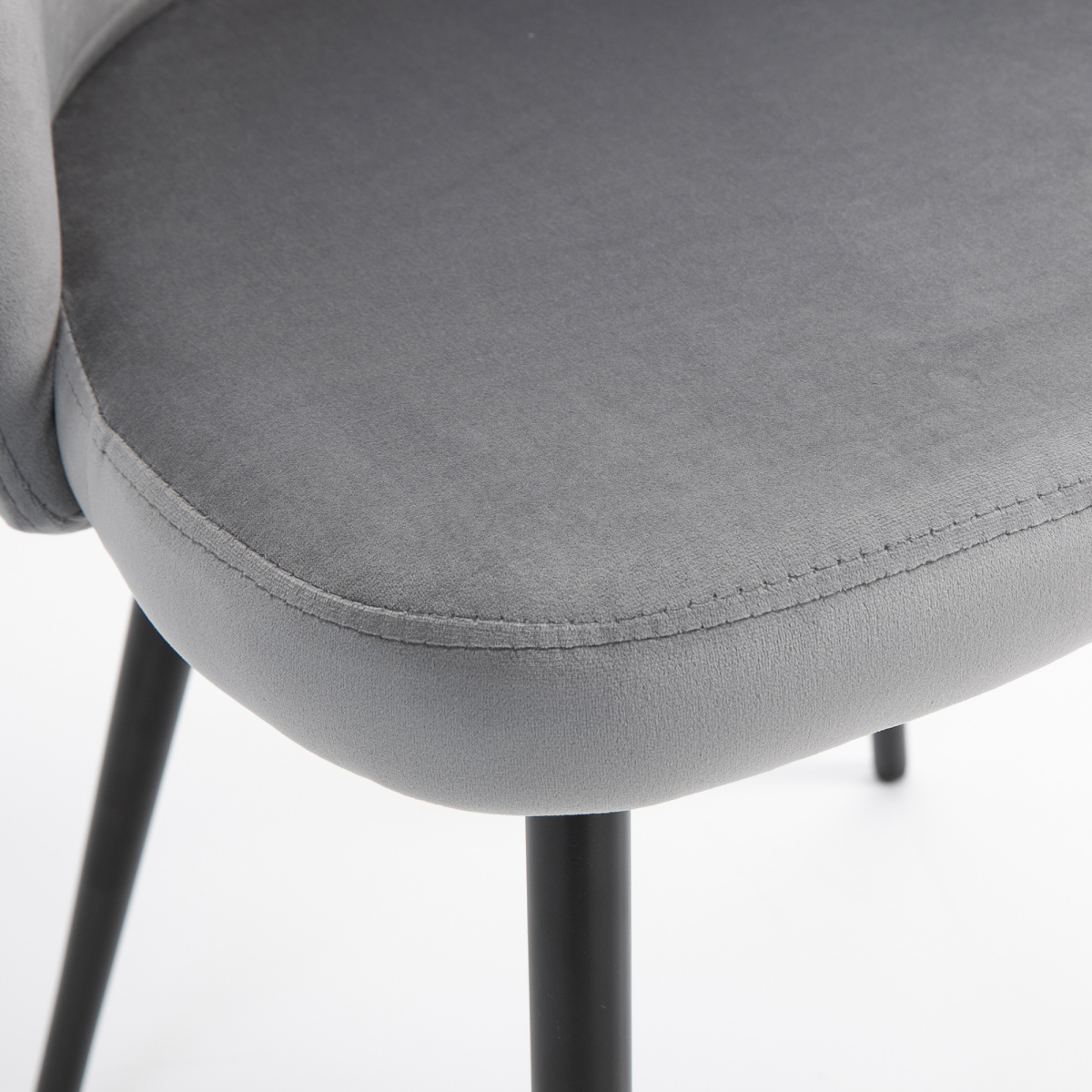 Set of two modern grey upholstered fabric bucket seat dining chairs with sleek, contemporary design.