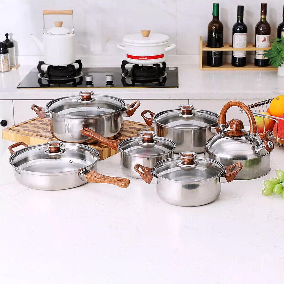 Set of 12 stainless steel cookware including saucepans, casseroles, and fry pans with glass lids from HOMCOM.
