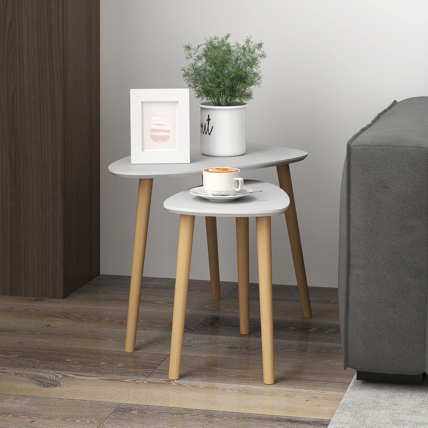 Pair of HOMCOM nesting coffee tables with light grey tops and solid wood legs, stackable side tables for living room or bedroom.