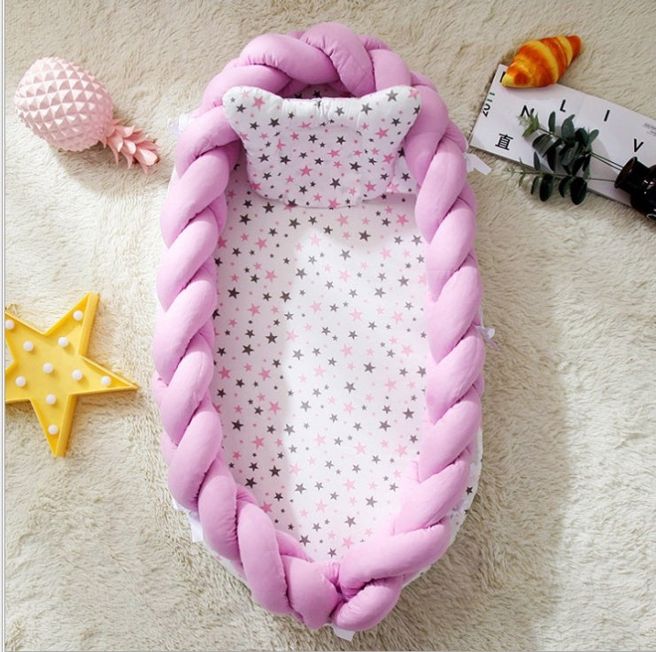 Portable cotton crib by HOMCOM with soft fabric sides and sturdy frame, designed for easy mobility and comfortable baby sleep.