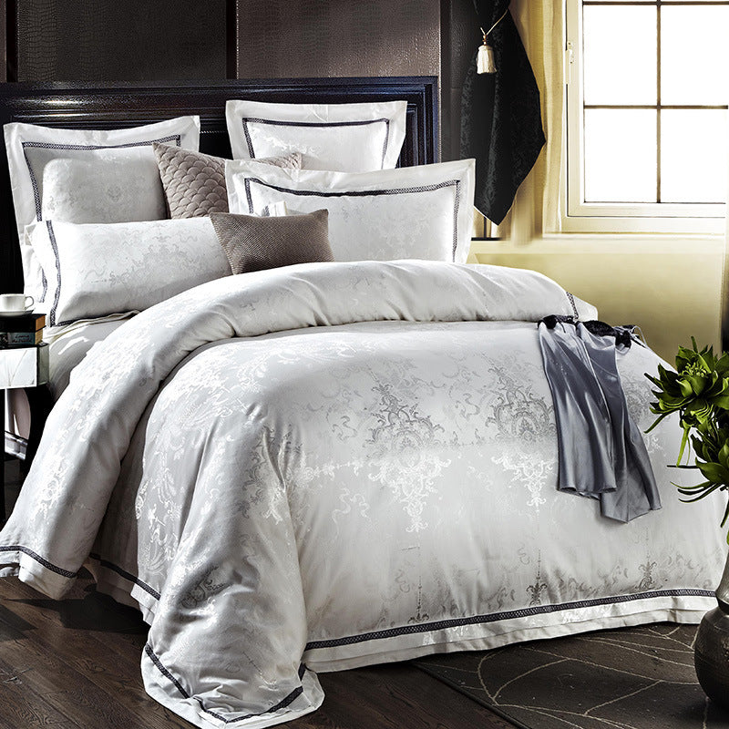 HOMCOM four-piece home textiles and bedding set with coordinated duvet cover, pillowcases, and bed sheets in soft, neutral colors.
