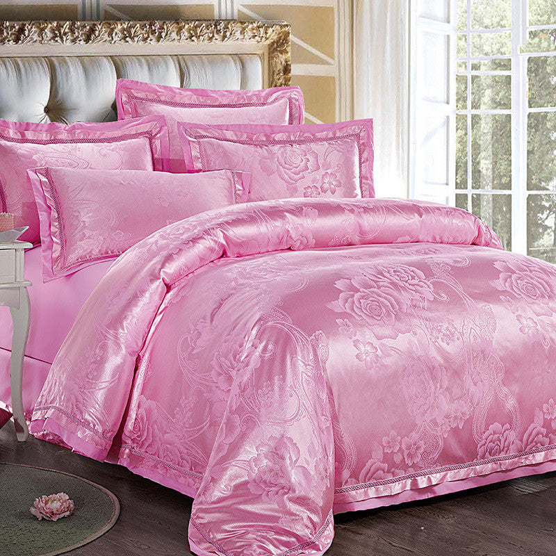 HOMCOM four-piece home textiles and bedding set with coordinated sheets, pillowcases, and comforter in soft, neutral fabric.