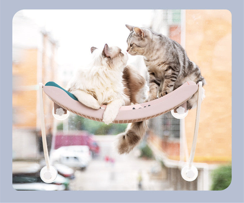 HOMCOM hanging cat hammock with sunbathing design, featuring a cozy fabric bed suspended by ropes for feline relaxation.