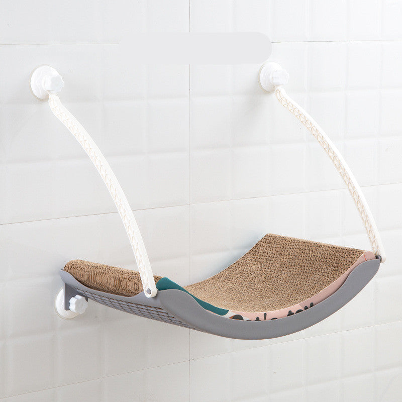 HOMCOM cat hammock hanging in a sunny spot, providing a cozy space for cats to relax and bask in the sun.