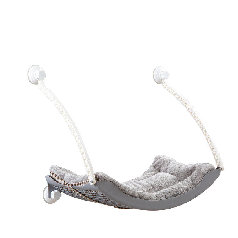 HOMCOM cat hammock hanging in a sunny spot with soft cushions, perfect for relaxing and lounging.