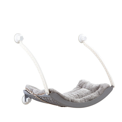 HOMCOM cat hammock hanging in a sunny spot with soft cushions, perfect for relaxing and lounging.
