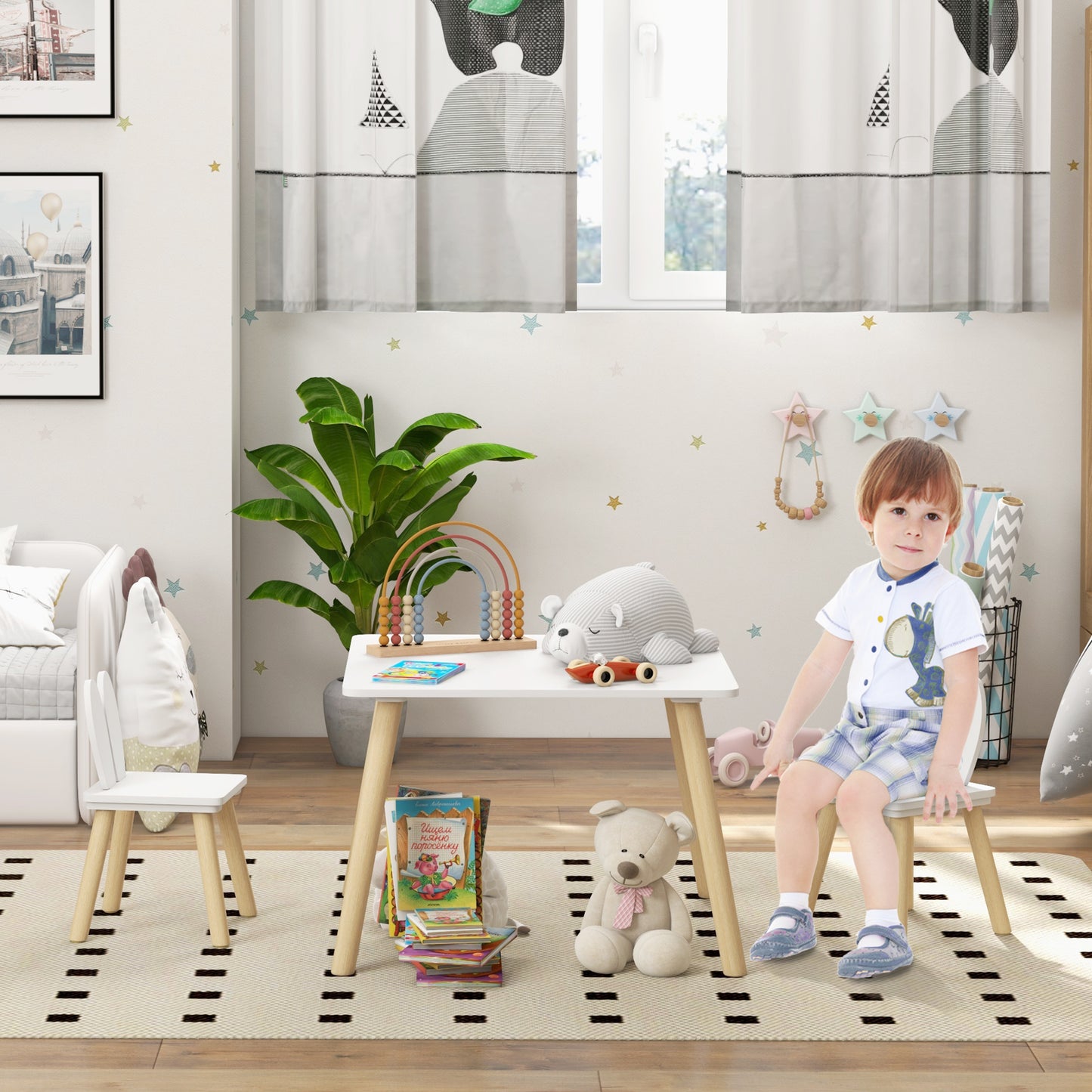 HOMCOM 3-piece toddler table and chair set with bunny ear backrests, perfect for nursery or playroom activities.