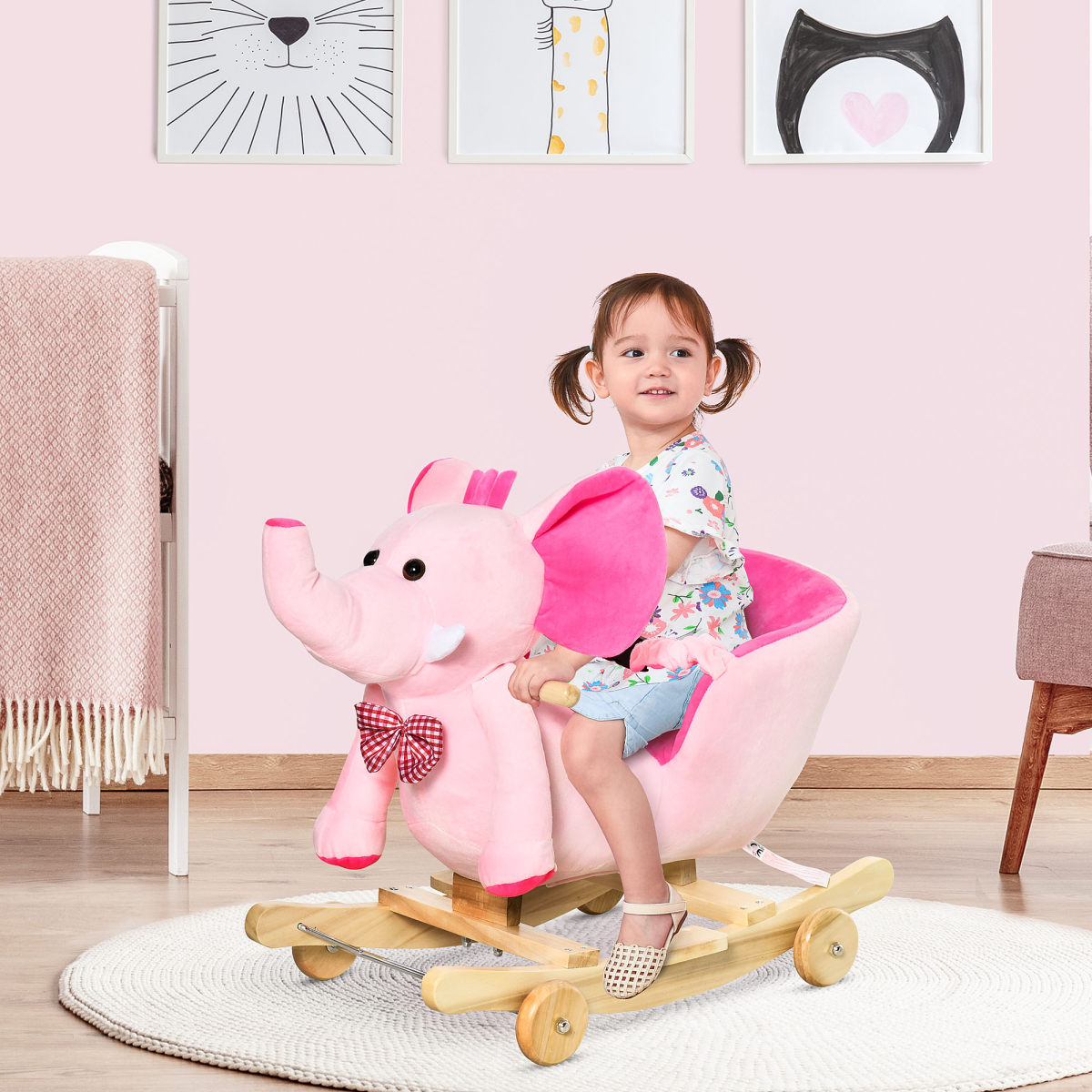 Pink HOMCOM 2-in-1 baby rocking horse and ride-on elephant with wheels, featuring musical sounds and child-friendly design.