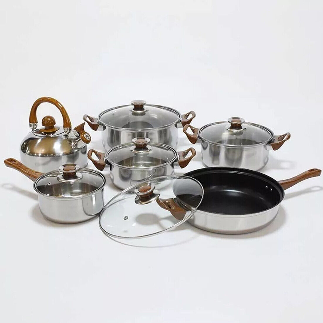 Set of 12 HOMCOM stainless steel cookware including saucepans, casseroles, and fry pans with glass lids, displayed together.