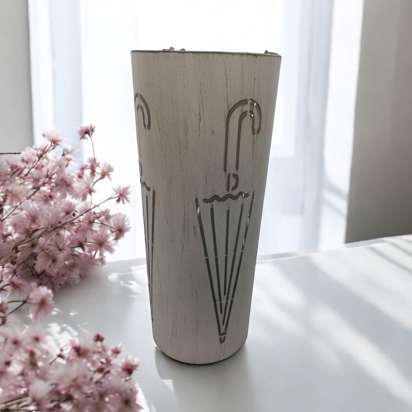 Cream metal umbrella stand, 49cm tall, with a sleek, modern design from MSL, suitable for indoor use and organizing umbrellas.