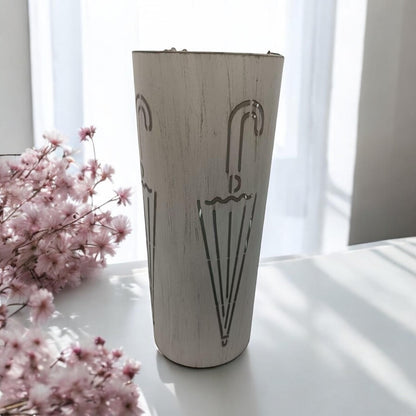 Cream metal umbrella stand, 49cm tall, with a sleek, modern design from MSL, suitable for indoor use and organizing umbrellas.