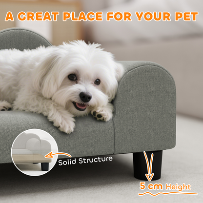Soft dog bed or pet sofa with cushioned surface and raised edges, designed for comfort and relaxation for small to medium dogs.