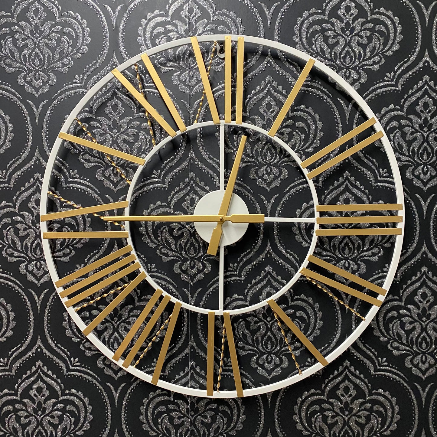 MSL 60cm wall clock with black hour and minute hands, large round white face, and modern minimalist design.