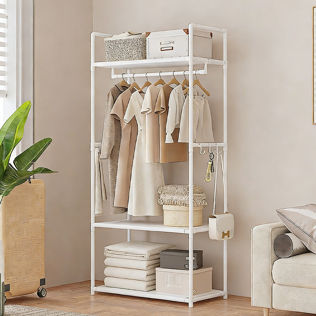 HOMCOM multifunctional clothes rail and shoe rack in white with open shelves and hanging bars, ideal for home storage.
