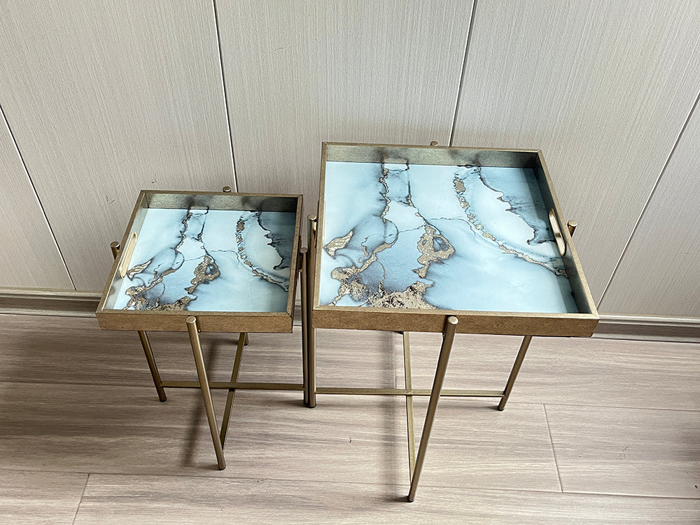 Set of two square tables from MSL, 53x45cm, with sleek modern design and smooth wooden surfaces.