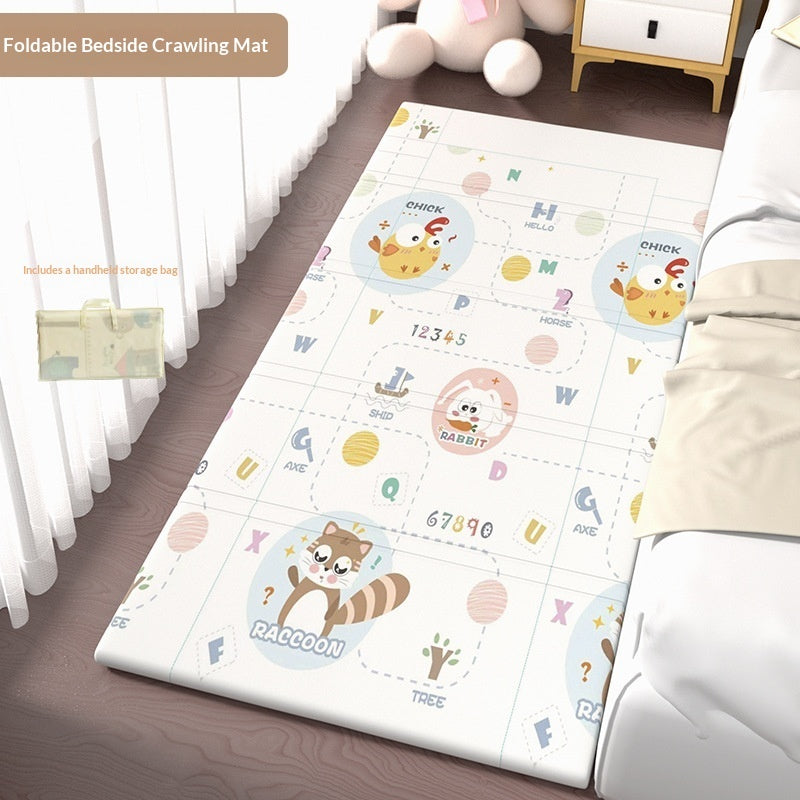 HOMCOM foldable baby crib side mat for protection, showing soft padded surface and foldable design in a living room setting.