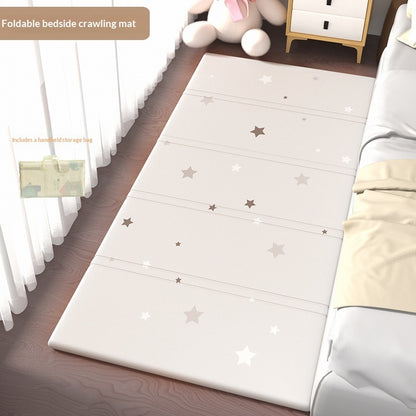 HOMCOM foldable baby crib side mat for protection, shown in a living room setting with soft padding and secure edges.