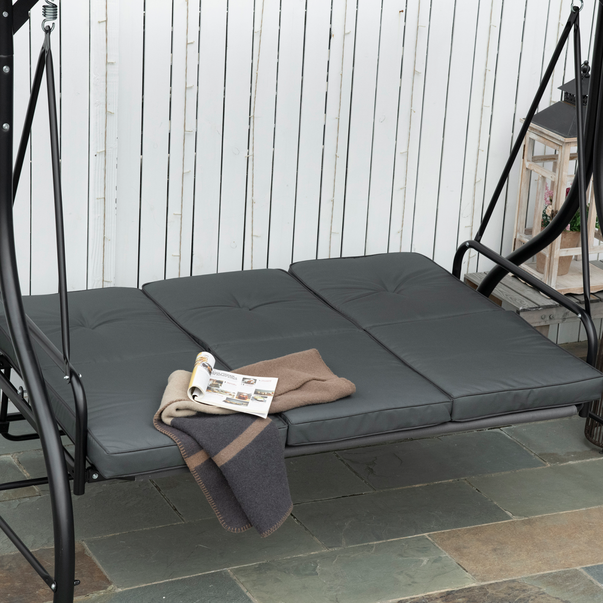 Outsunny 3-seater canopy swing chair with dark grey fabric, porch hammock bed, and rocking bench for outdoor relaxation.