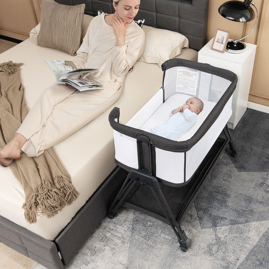Livoshop baby bedside crib with mattress for birth to 9kg, featuring secure sides and cozy sleeping area for infants.
