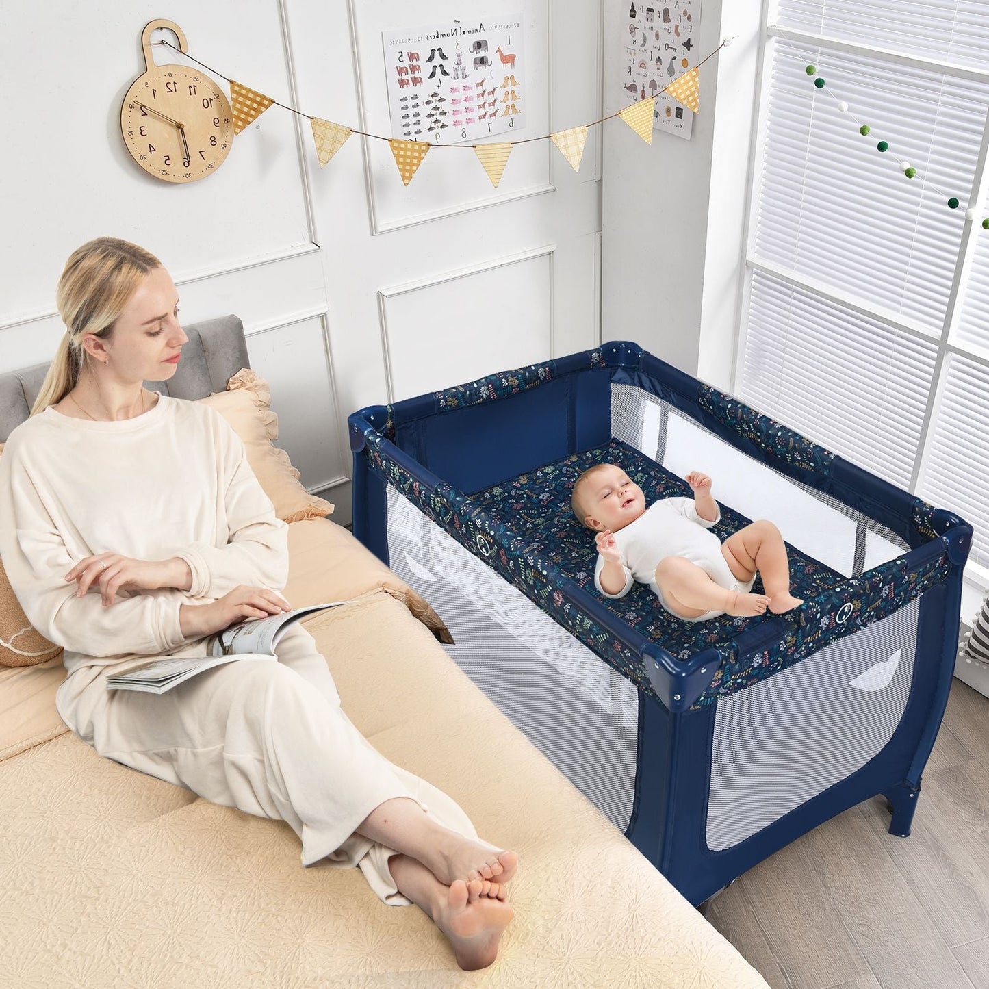 Livoshop 2-in-1 foldable baby playpen with lockable wheels and soft mattress for safe, versatile play and rest.