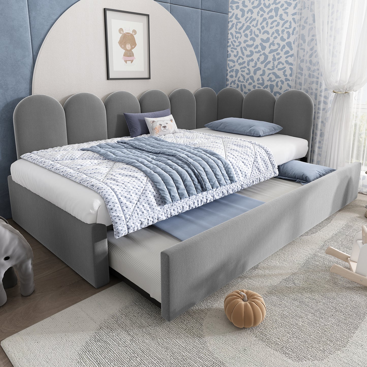 Grey velvet upholstered sofa bed with slatted frame, featuring a pull-out single bed for adults and children.