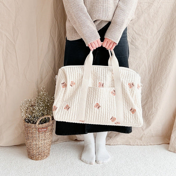Large embroidered travel bag by eprolo featuring spacious capacity, sturdy handles, and stylish design with intricate embroidery details.