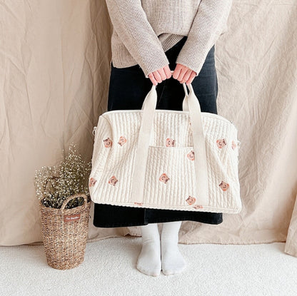 Large embroidered travel bag by eprolo featuring spacious capacity, sturdy handles, and stylish design with intricate embroidery details.