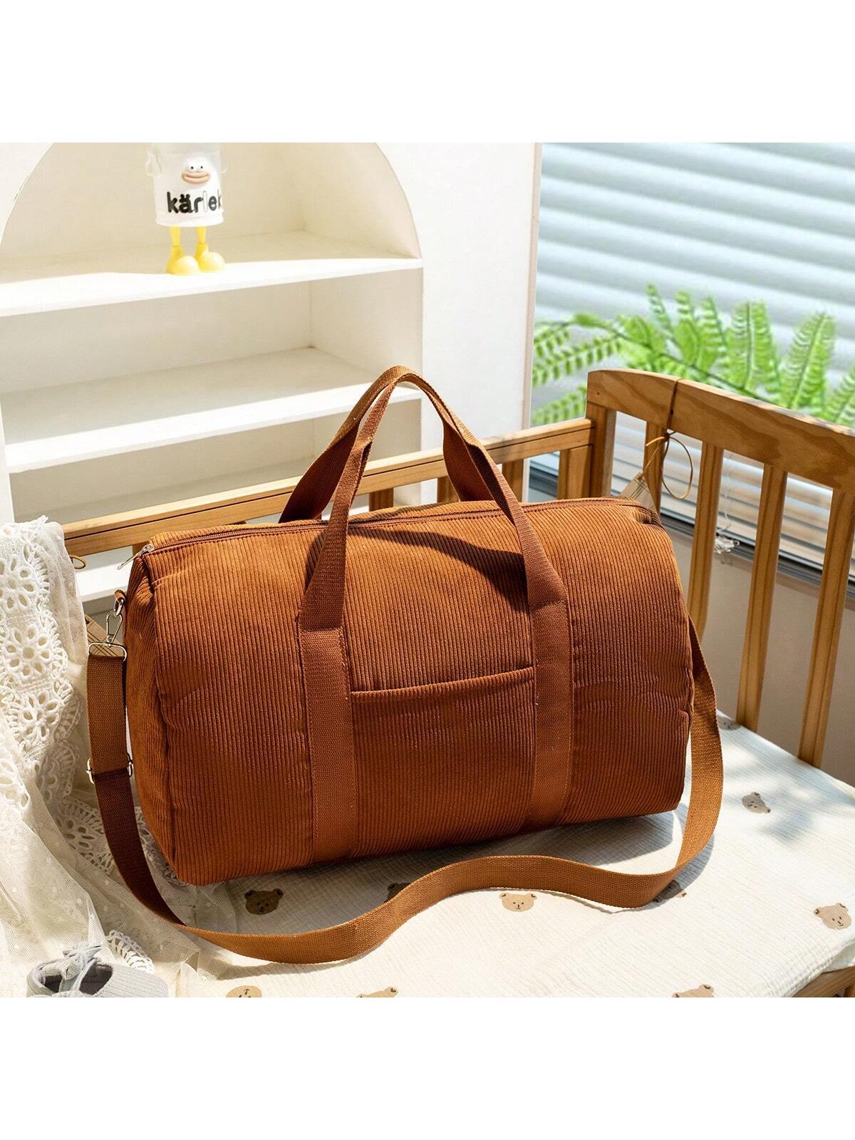 Large embroidered travel bag by eprolo with spacious design, sturdy handles, and detailed embroidery on durable fabric.