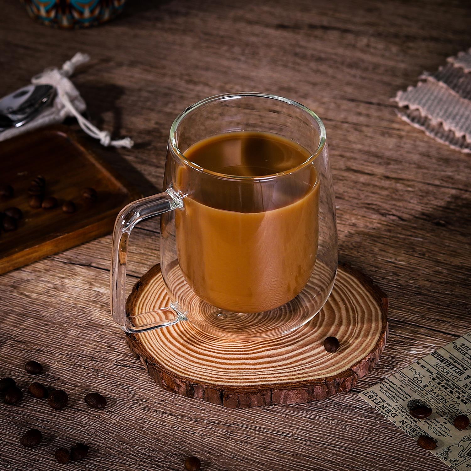 Set of two Vinsani double-walled coffee glasses with 305ml capacity, showcasing clear glass construction and ergonomic design.