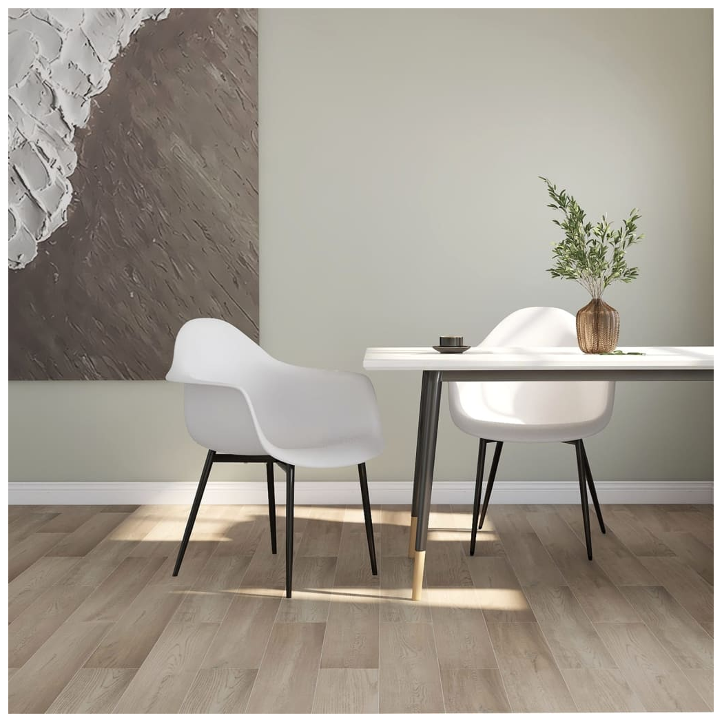 Pair of white vidaXL dining chairs with polypropylene seats and sleek modern design.