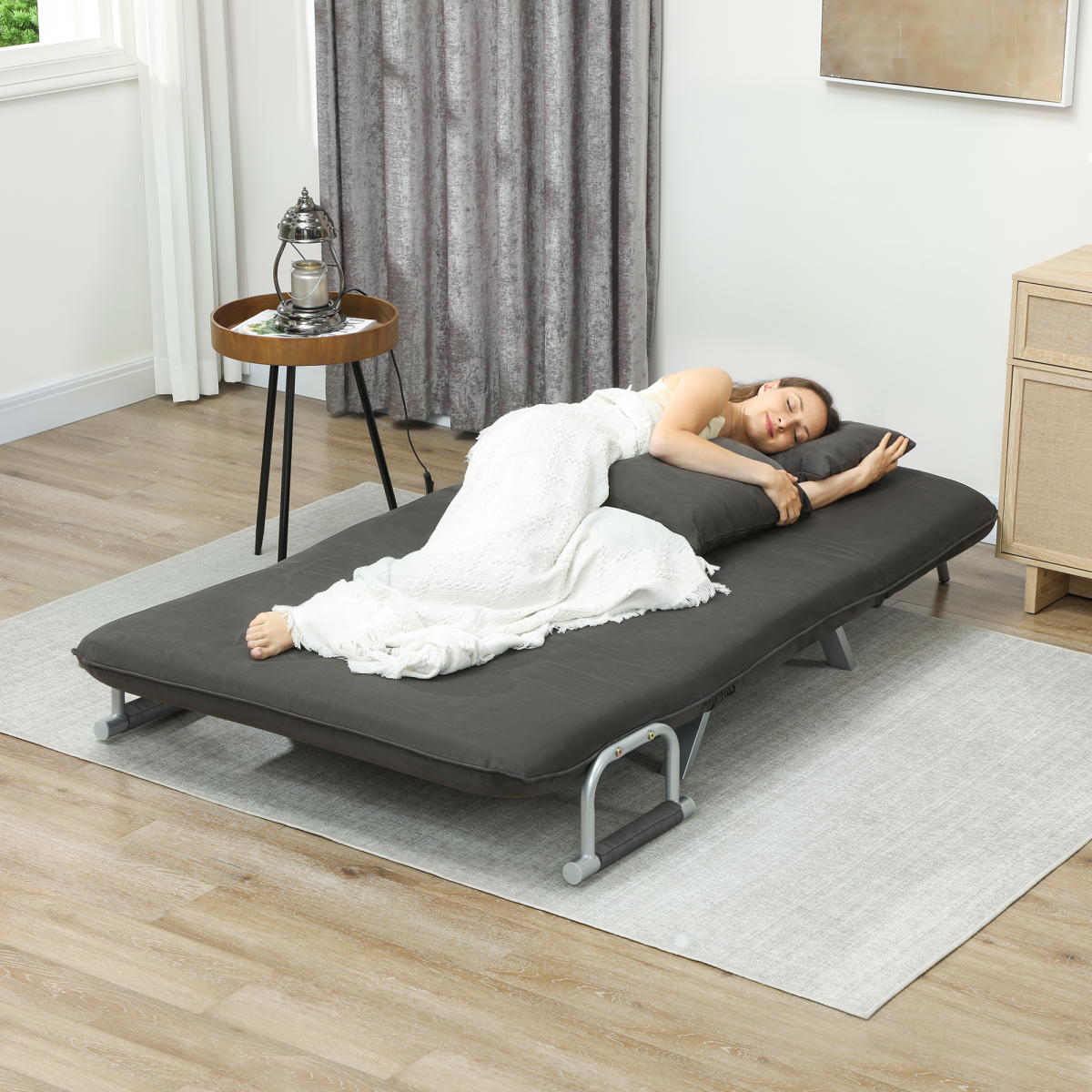 HOMCOM abric convertible 2-seater sofa bed with two pillows, showcasing its modern design and versatile seating and sleeping options.