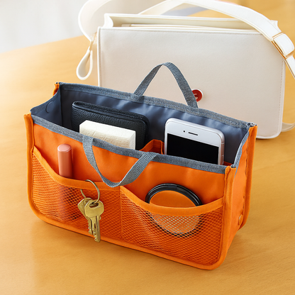 Avilo Be Organised Bag with multiple compartments and adjustable straps, shown in a sleek, modern design.