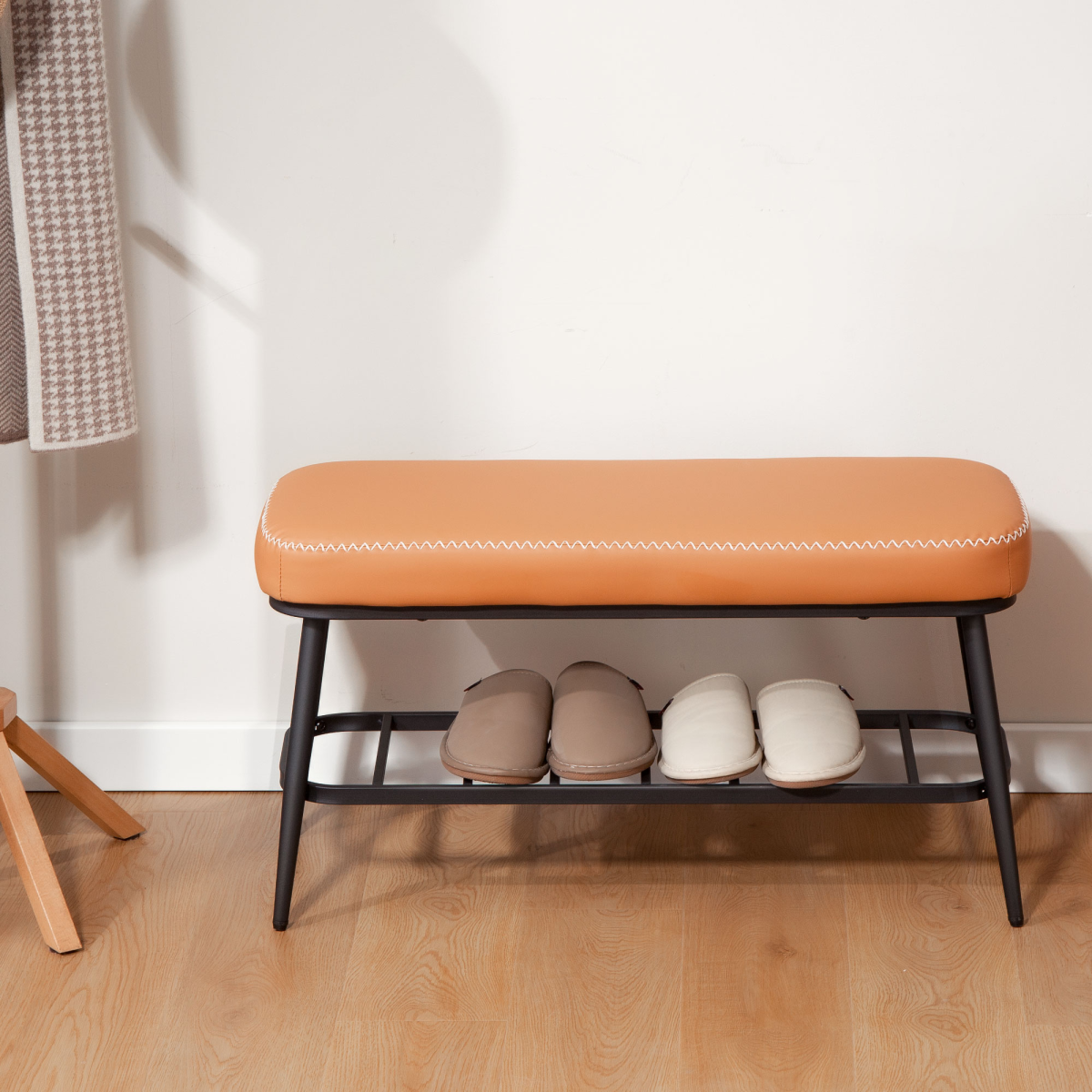 HOMCOM PU leather shoe storage bench with cushioned seat and metal legs, ideal for entryway organization and footwear storage