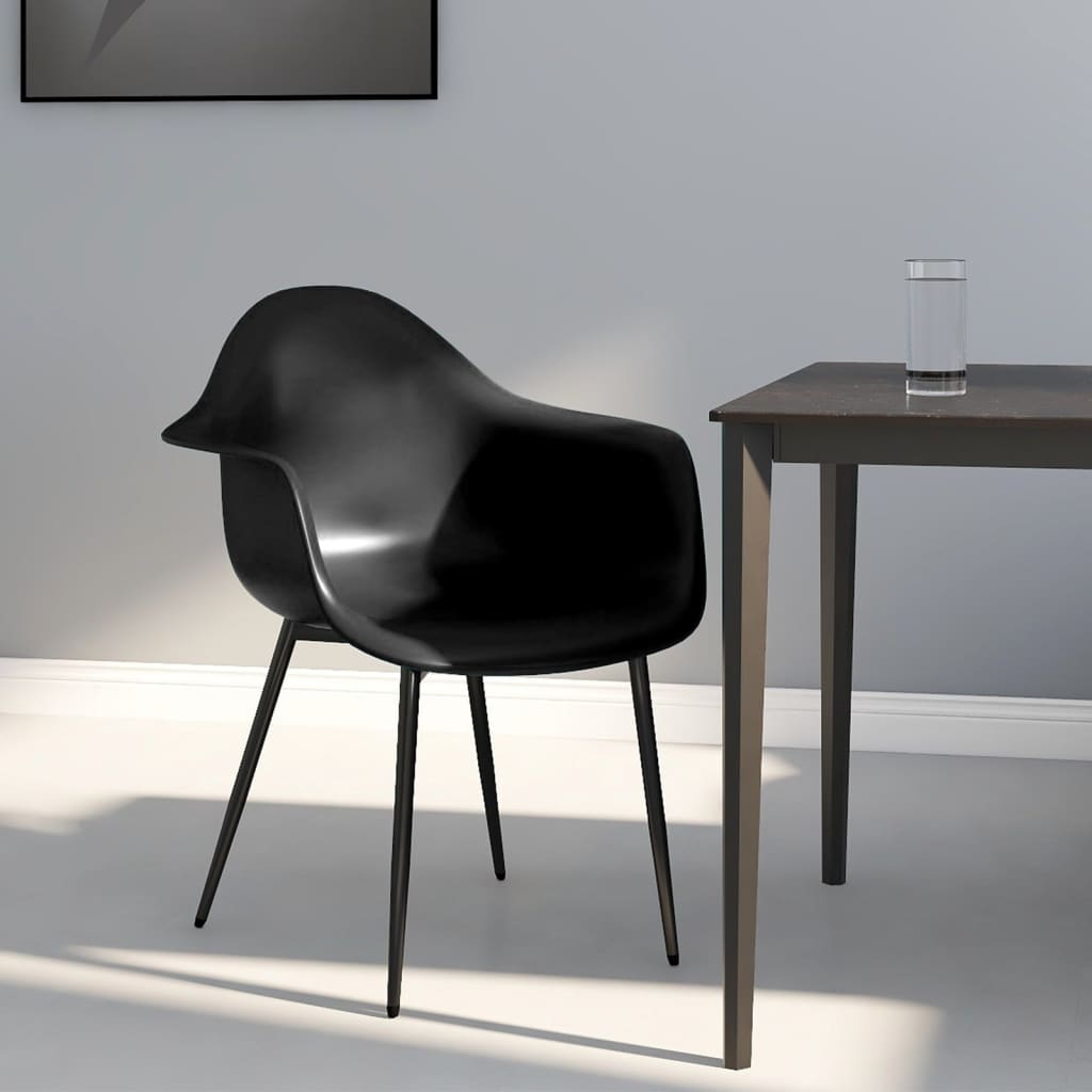Pair of white vidaXL dining chairs with durable plastic (PP) seats and sleek modern design.
