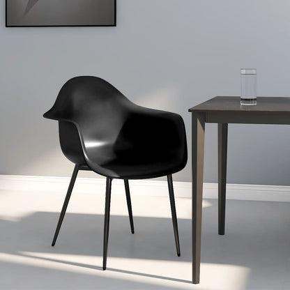 Pair of white vidaXL dining chairs with durable plastic (PP) seats and sleek modern design.