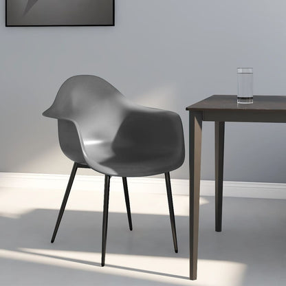 Pair of white polypropylene dining chairs from vidaXL, modern design with sleek legs, perfect for contemporary dining rooms.