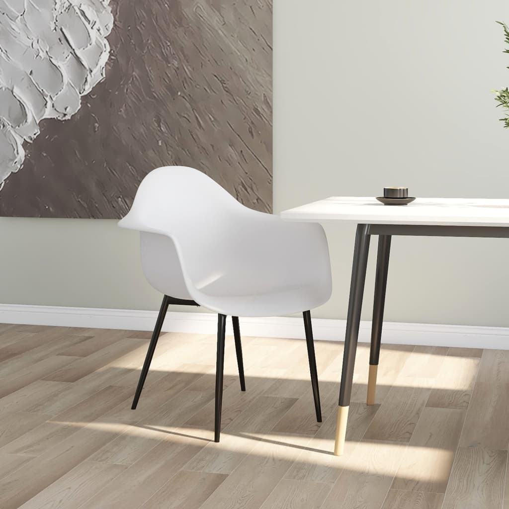 Pair of white vidaXL dining chairs made of durable polypropylene with sleek, modern design for kitchen or dining room use.