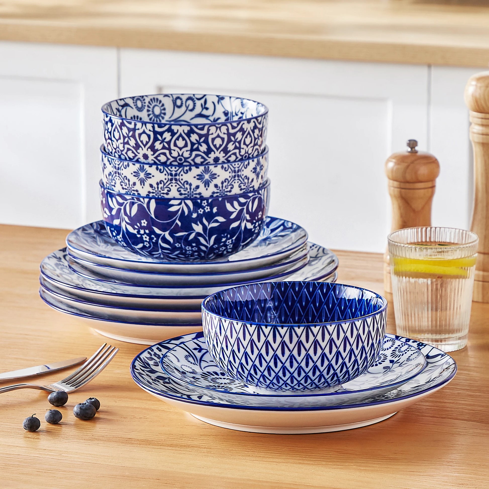 Set of Chinese blue and white porcelain dinner plates, dessert plates, and cereal bowls by Livoshop for elegant tableware.