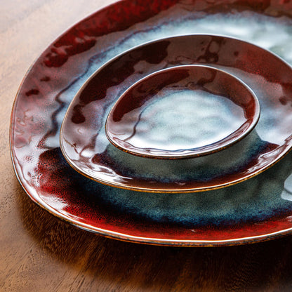 Starry Red ceramic dinnerware set with serving platter, dessert plates, bowls, and saucers in vintage style by Livoshop.