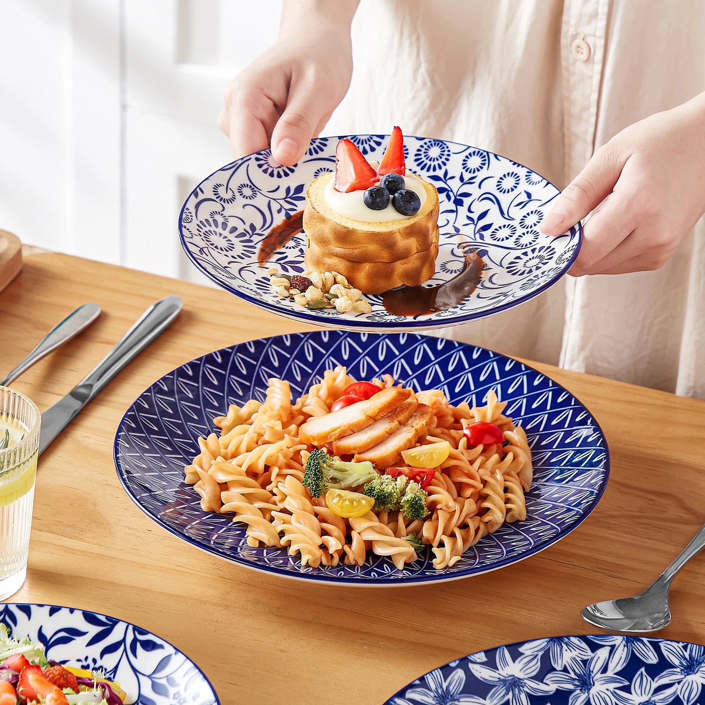 Set of Chinese blue and white porcelain plates including dinner, dessert, and cereal bowls from Livoshop.