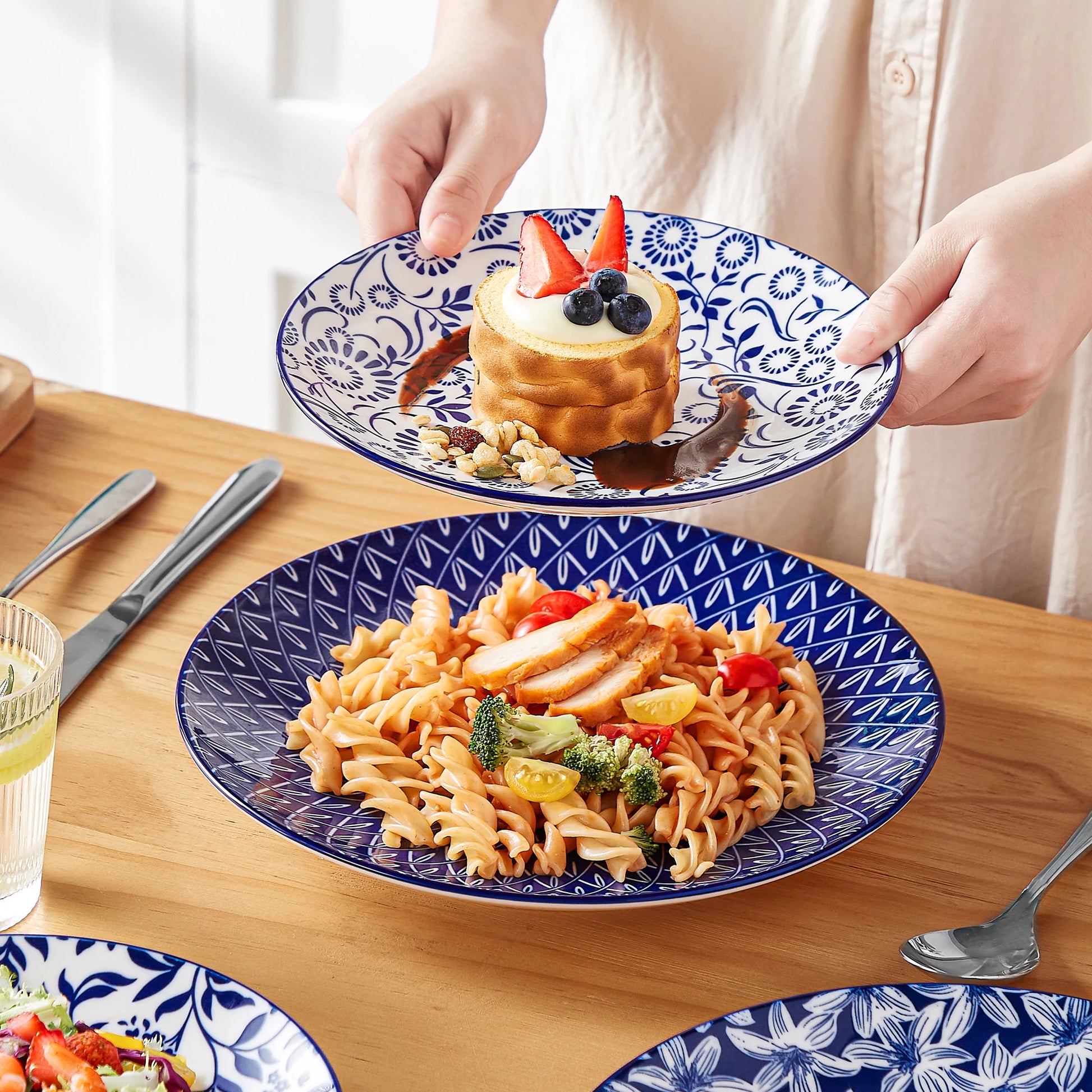 Set of Chinese blue and white porcelain plates including dinner, dessert, and cereal bowls from Livoshop.