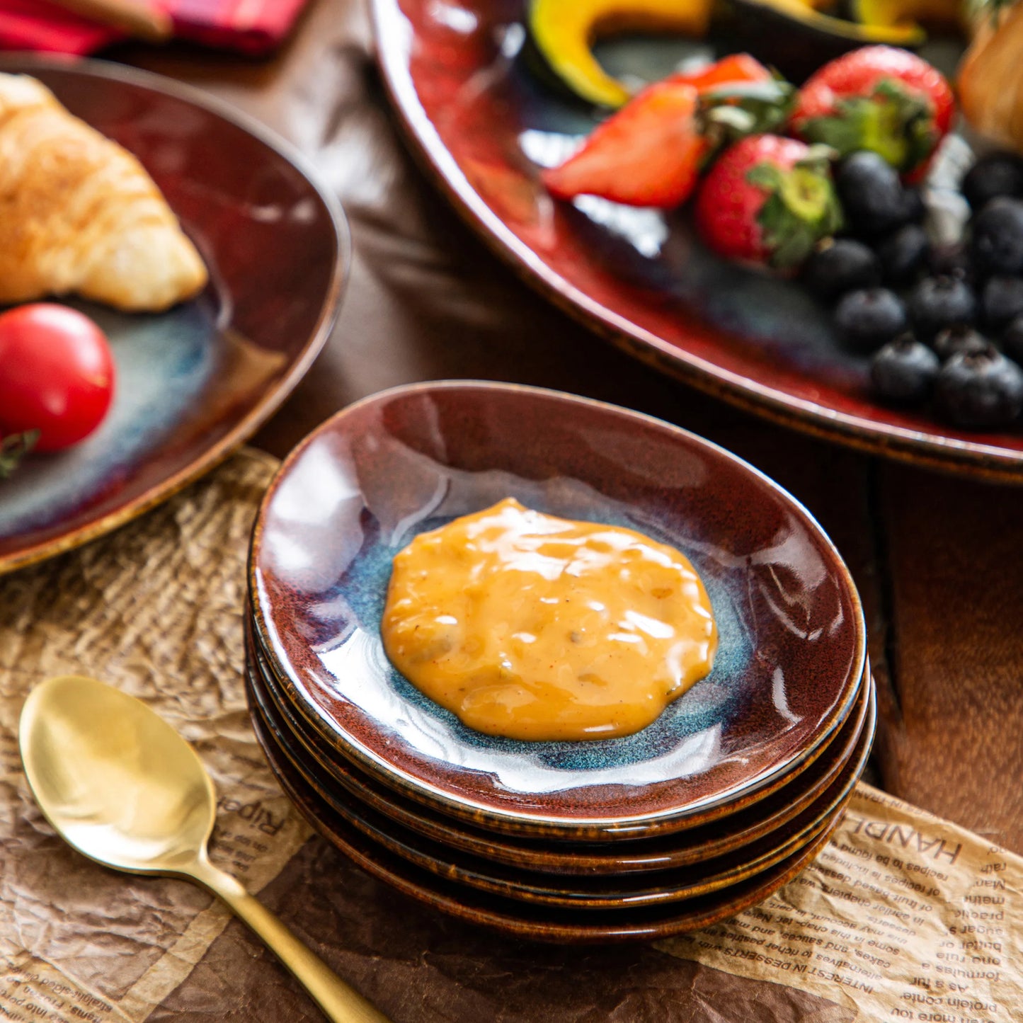 Starry Red ceramic dinnerware set by Livoshop includes plates, bowls, saucers, and a serving platter with a vintage look.
