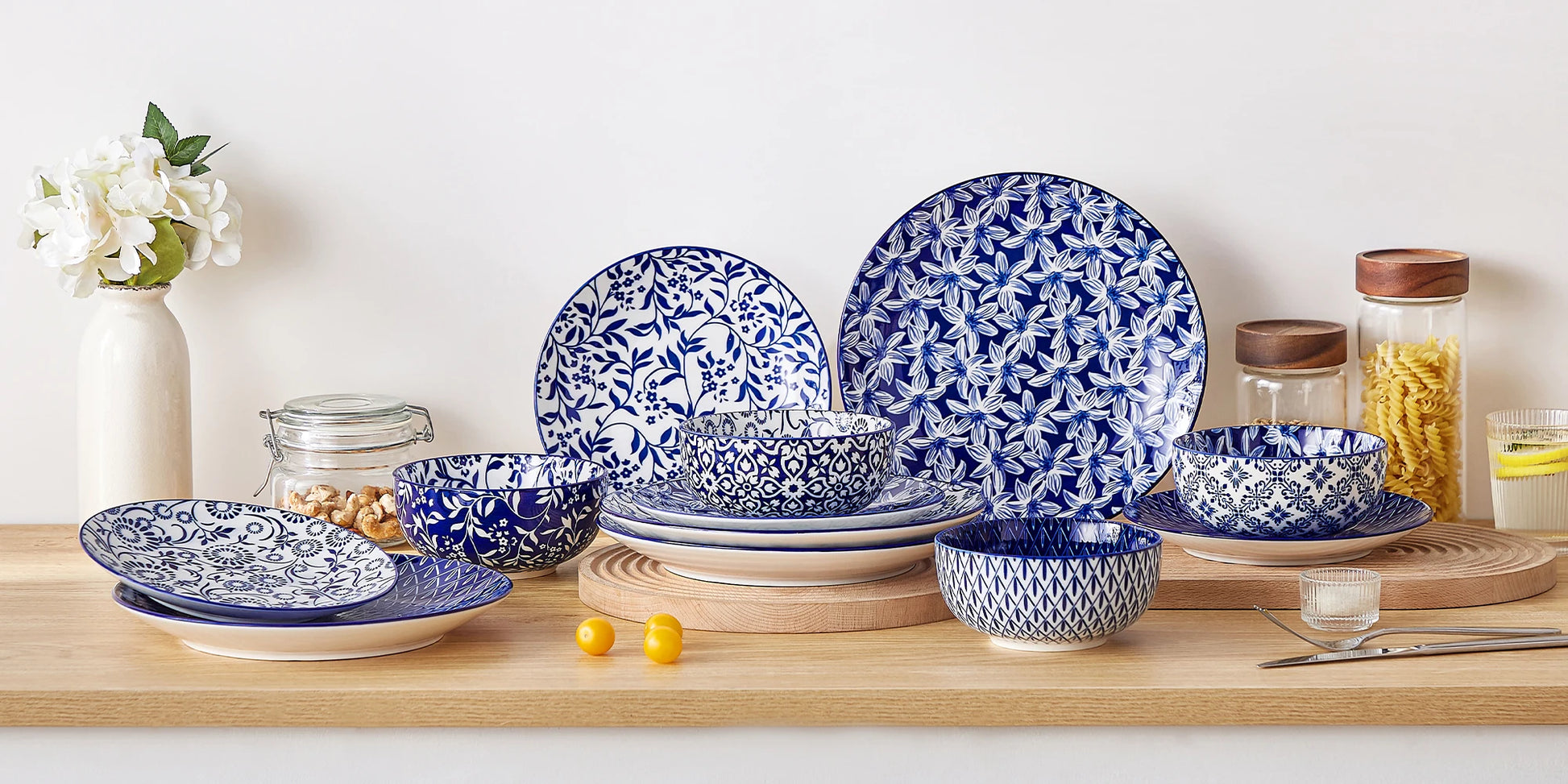 Set of 12/24/36 Chinese blue and white porcelain dinner plates, dessert plates, and cereal bowls with intricate floral patterns.