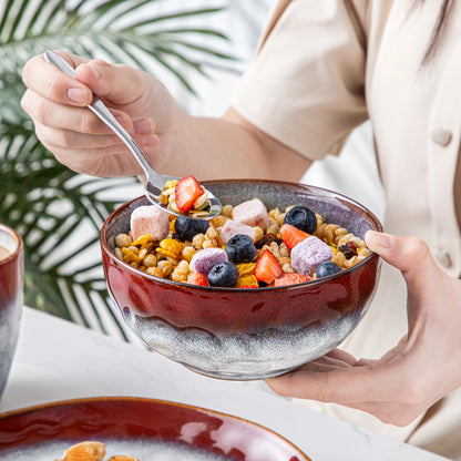 Livoshop 16/32-piece dinner set with red and green kiln-change glaze, includes dinner plates, dessert bowls, and mugs.