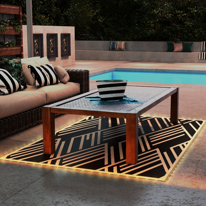 Waterproof outdoor rug by Outsunny with integrated LED string lights, measuring 182 x 274cm, suitable for patio or garden use.