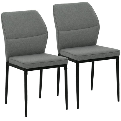 Pair of HOMCOM velvet dining chairs with ergonomic support and space-saving design, showcasing plush upholstery and modern style.