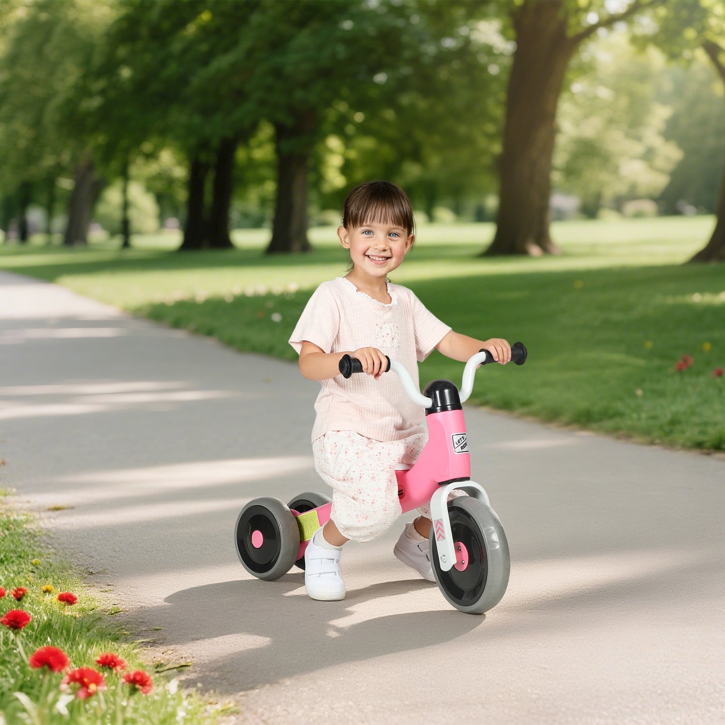 Pink HOMCOM toddler balance bike with no pedals, 3 silent wheels for ages 12-36 months, suitable for indoor and outdoor use.