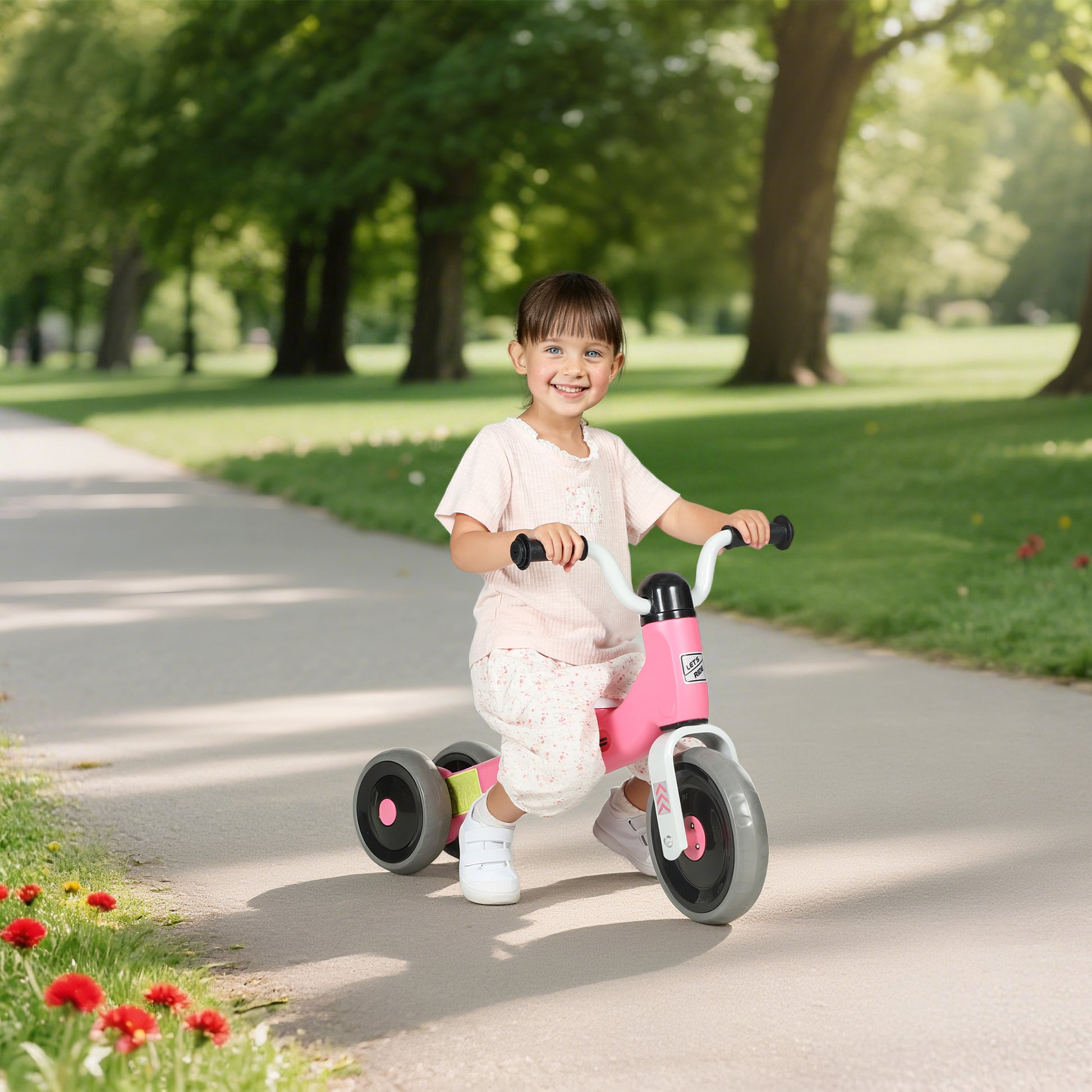 Pink HOMCOM toddler balance bike with no pedals, 3 silent wheels for ages 12-36 months, suitable for indoor and outdoor use.